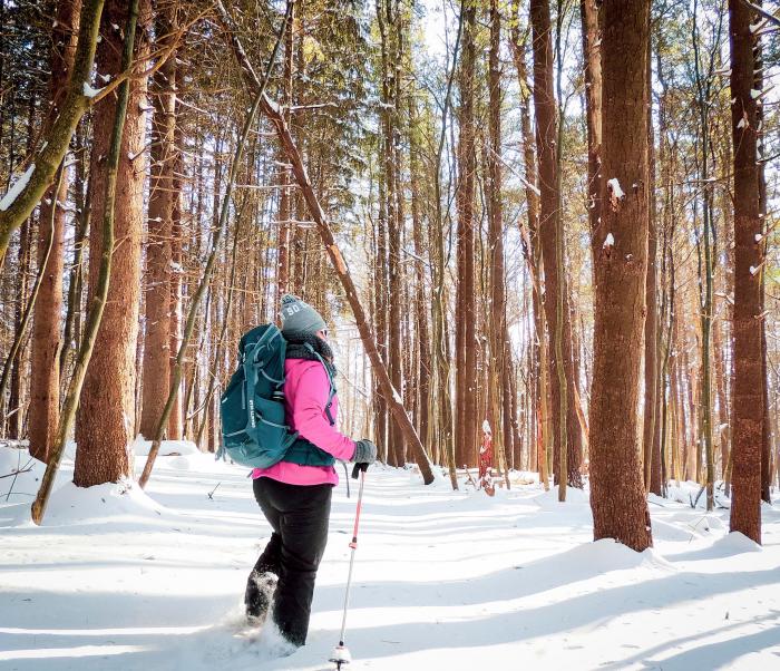 Woman in snowy forest