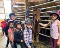 kids riding horses at Wolcott Farms in Warsaw NY